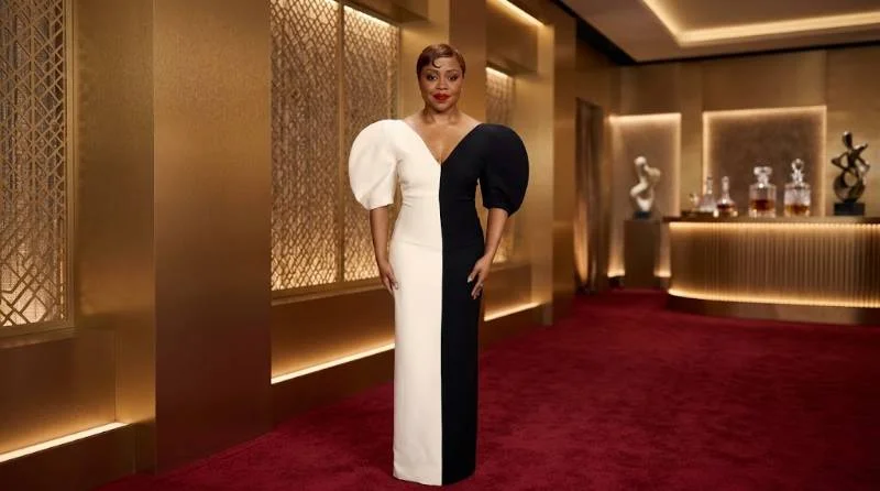 Quinta Brunson in a bronze gown on an awards red carpet